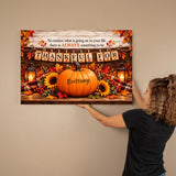 A woman in a black shirt is holding a framed autumn-themed canvas print against a beige wall. The print features a large orange pumpkin with the name 'Brittany' on it, surrounded by sunflowers, fall leaves, lanterns, and a banner that reads 'THANKFUL FOR'.
