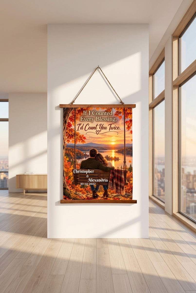 Personalized hanging wall art featuring a couple sitting on a bench by a lake at sunset, surrounded by autumn foliage. The text reads, 'If I Counted Every Blessing, I'd Count You Twice.
