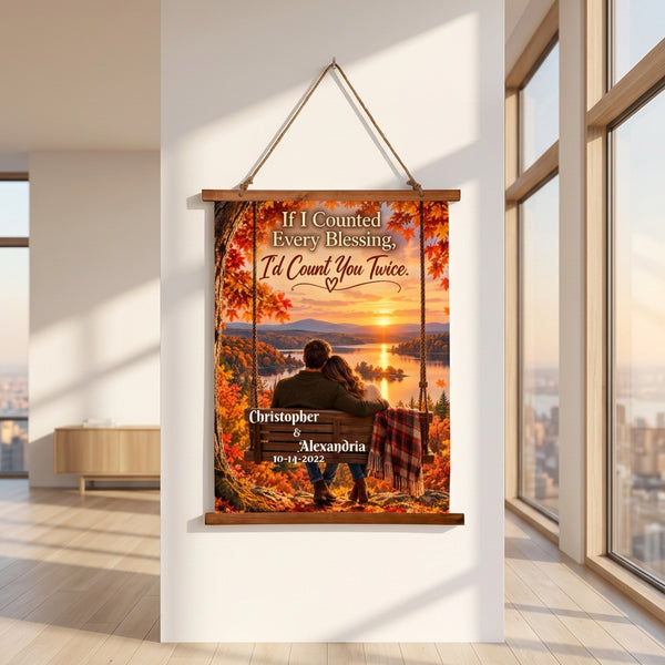 Personalized hanging wall art featuring a couple sitting on a bench by a lake at sunset, surrounded by autumn foliage. The text reads, 'If I Counted Every Blessing, I'd Count You Twice.