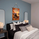 A vertical wall hanging poster with an autumn mountain landscape and a person on a horse, displayed above a bed in a styled bedroom. The poster includes the text 'Welcome to the Great Outdoors' and 'I'll Count You Free' with 'Colorado' and 'Montana' visible.