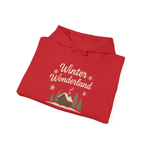 Folded red hoodie with 'Winter Wonderland' text and cabin graphic on a white background