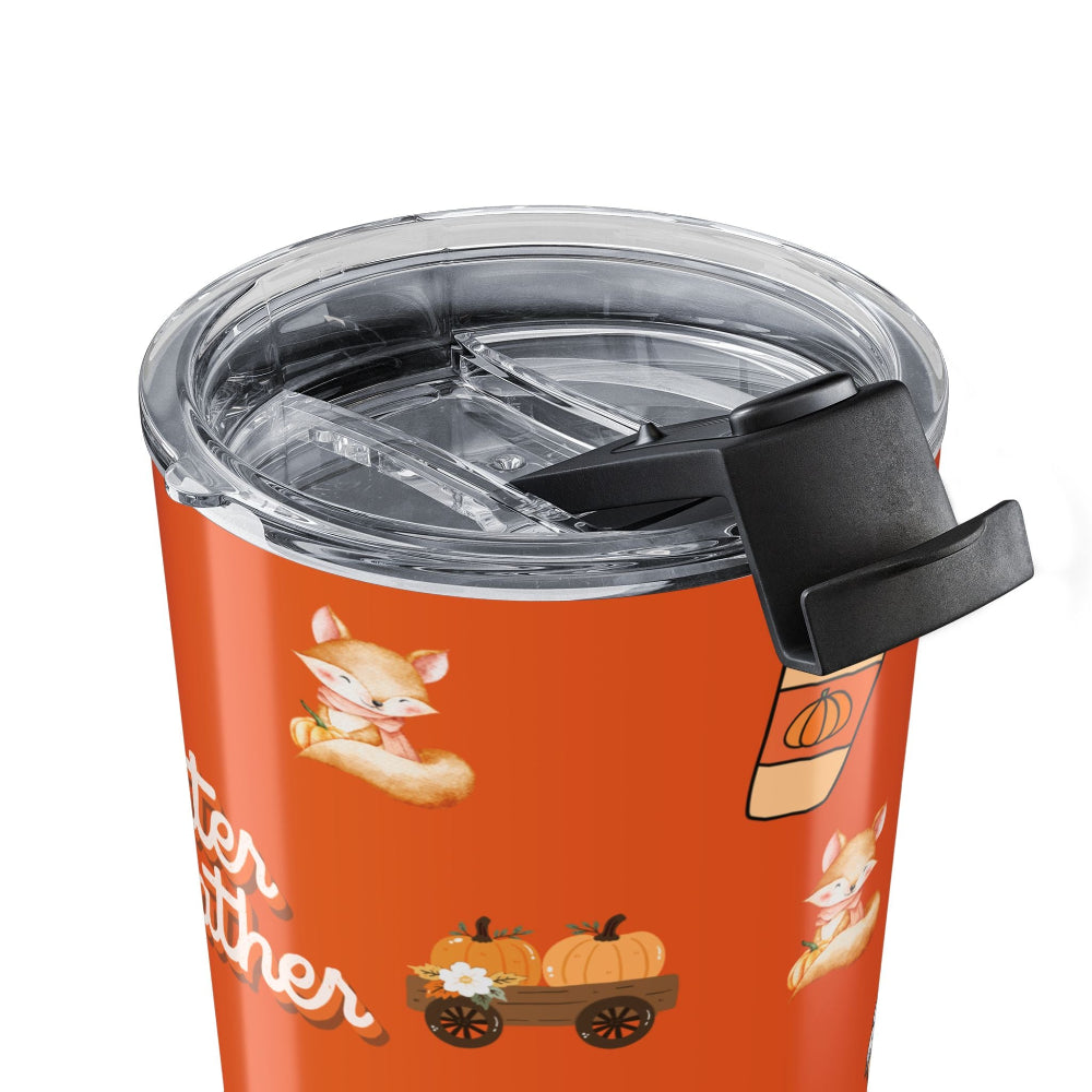 Orange tumbler with fox and pumpkin design on a white background
