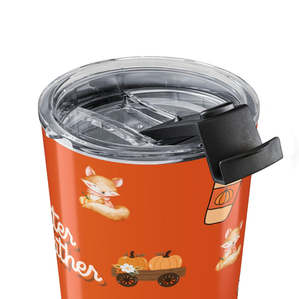Orange tumbler with fox and pumpkin design on a white background