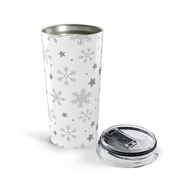 White tumbler with snowflake and star patterns on a white background