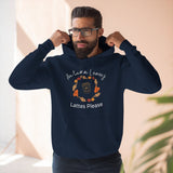 Man wearing a navy blue hoodie with autumn-themed text and graphics