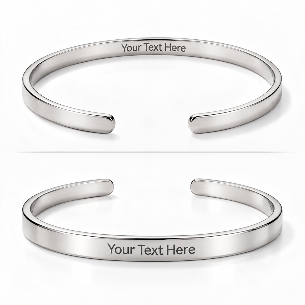 Two polished silver-tone open cuff bracelets shown on a white background, each with the text 'Your Text Here' engraved on the inside.