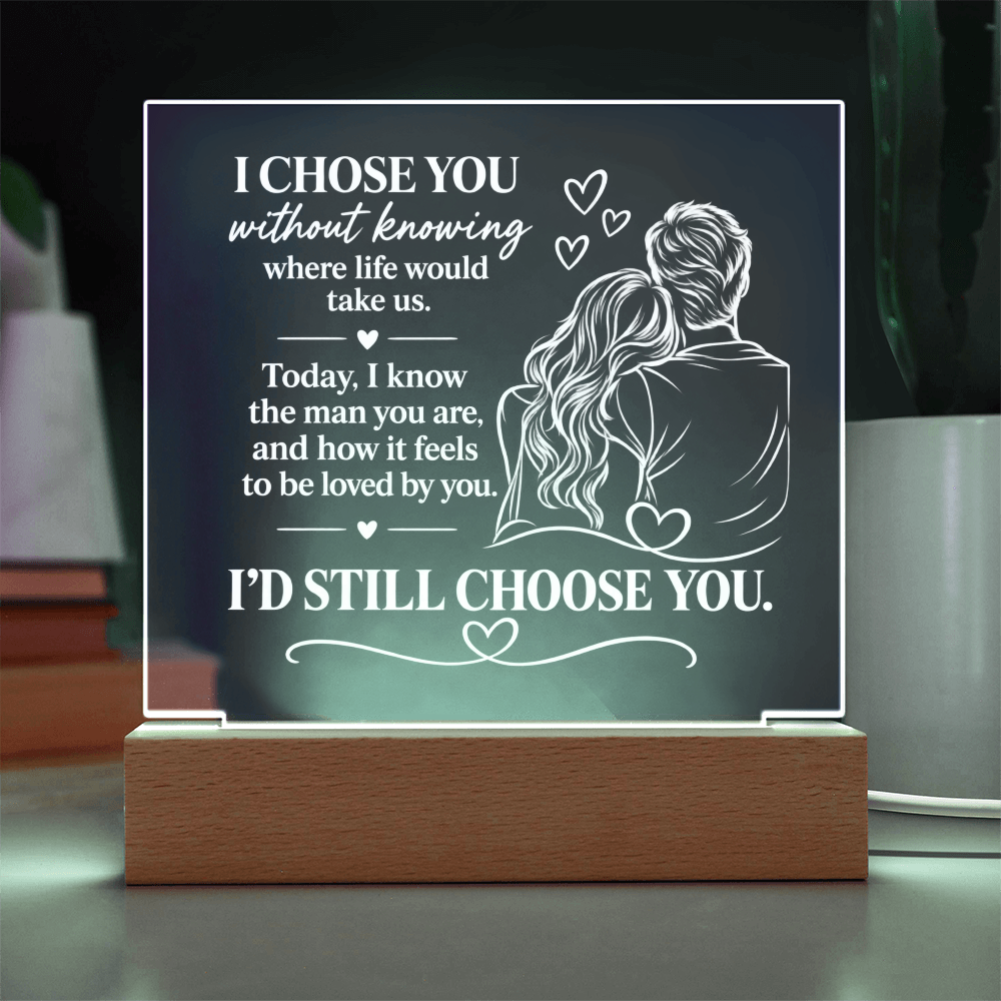 A rectangular acrylic LED night light on a wooden base, featuring a romantic quote and an illustration of a couple from behind, displayed on a tabletop.