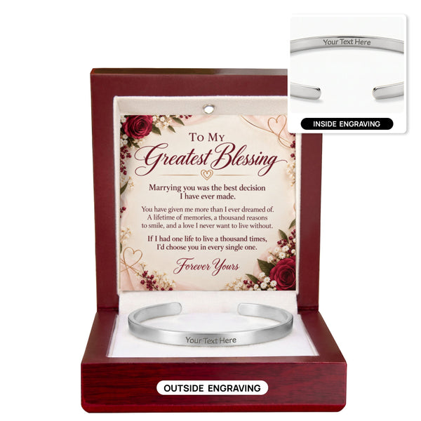 A silver cuff bracelet displayed inside an open reddish-brown wooden gift box with a printed message card. The image includes two inset callouts showing the bracelet engraved on the outside and inside, with placeholder text 'Your Text Here'.
