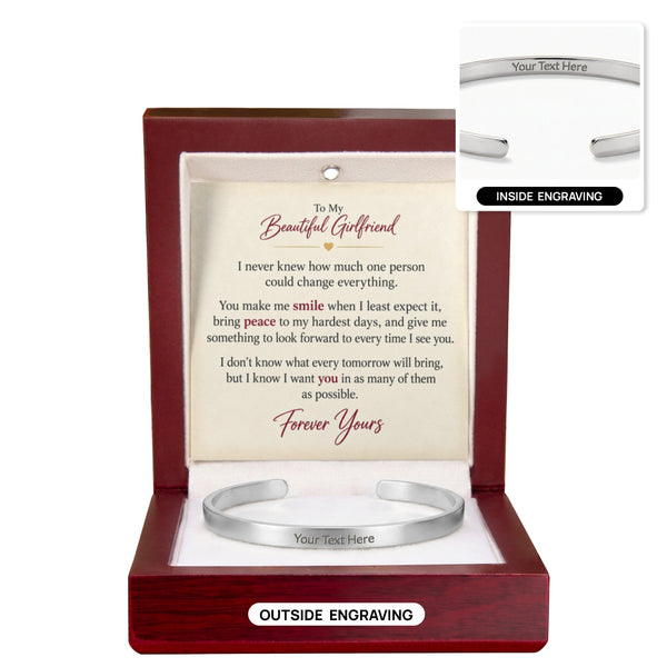 A silver engraved cuff bracelet presented in an open reddish-brown gift box with a printed message card. The image includes inset callouts showing inside engraving and outside engraving on the bracelet, all on a white background.