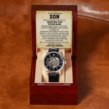 Automatic skeleton watch with black leather strap and To My Amazing Son message card displayed in a mahogany-style gift box.