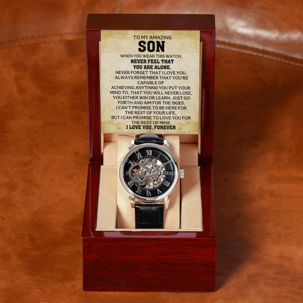 Automatic skeleton watch with black leather strap and To My Amazing Son message card displayed in a mahogany-style gift box.
