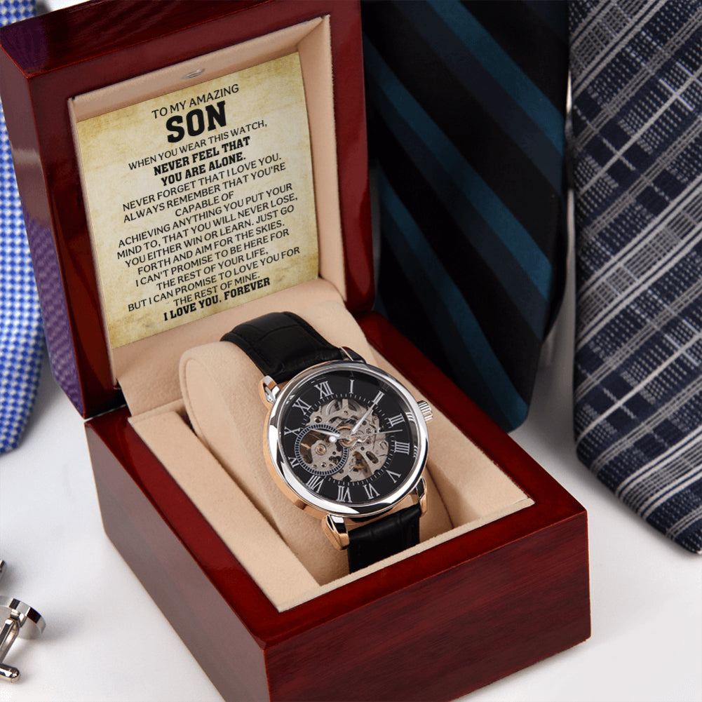Men's skeleton watch presented in a luxury gift box with an inspirational message card for son beside a dress shirt and tie.