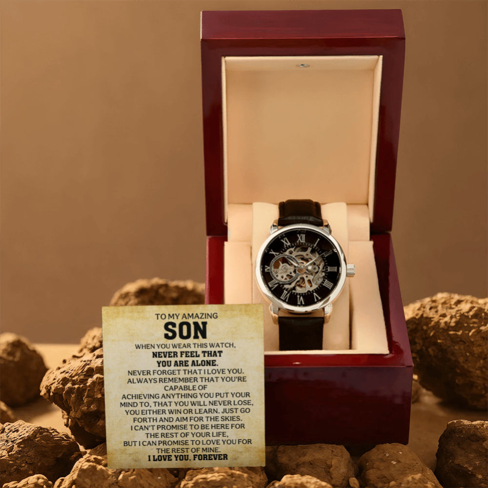 Men's automatic skeleton watch in an open mahogany-style gift box with a heartfelt To My Amazing Son message card on a rustic display.