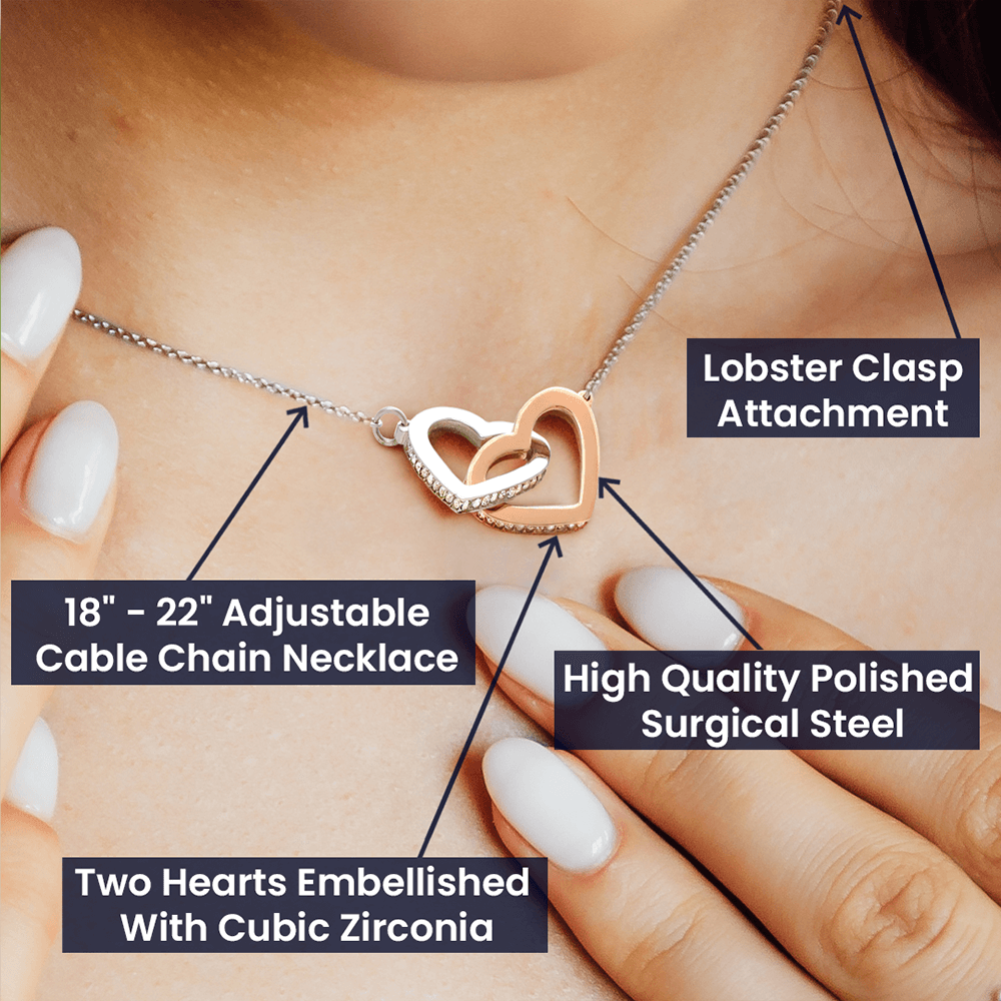 Necklace with heart design and adjustable cable chain on a person's neck, labeled features.