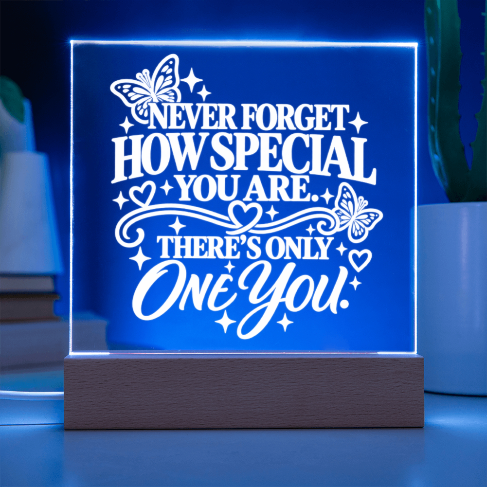 Meaningful acrylic keepsake for daughter glowing blue on wooden LED base