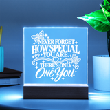 Light up acrylic keepsake for daughter glowing light blue on wooden base