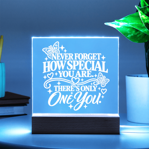 Light up acrylic keepsake for daughter glowing light blue on wooden base