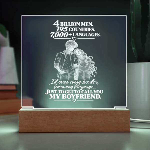 A rectangular acrylic LED night light on a wooden base, featuring a romantic quote and an illustration of a couple from behind, displayed on a tabletop.