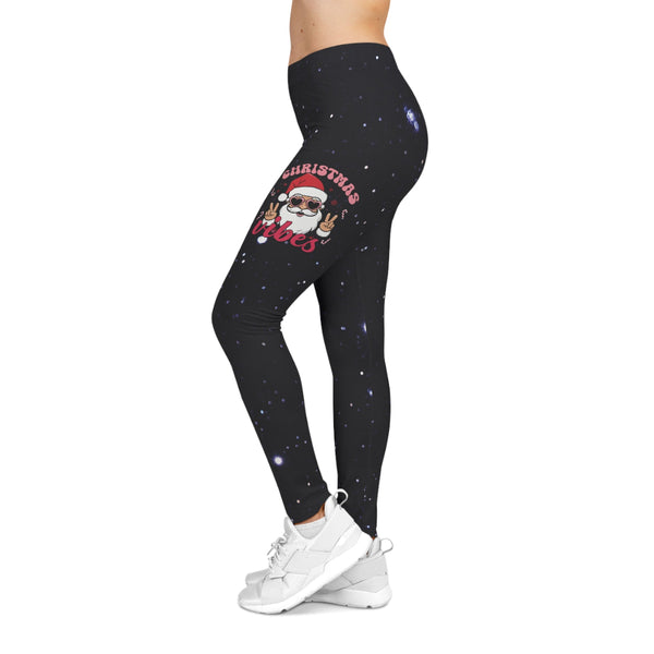 Black leggings with Christmas design worn by a person on a white background
