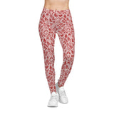 Red and white patterned leggings worn by a person on a white background