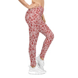 Red and white patterned leggings worn by a person on a white background