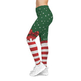 Green leggings with red and white pattern worn by a person on a white background