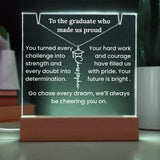 Decorative plaque with printed message and necklace on a wooden base