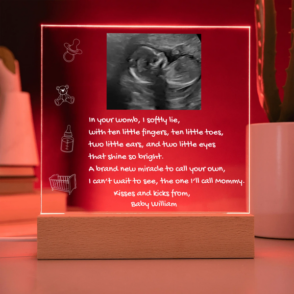 Decorative sign with ultrasound photo and text on a red background