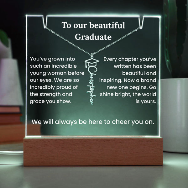 Decorative plaque with a necklace design and graduation message on a wooden base.