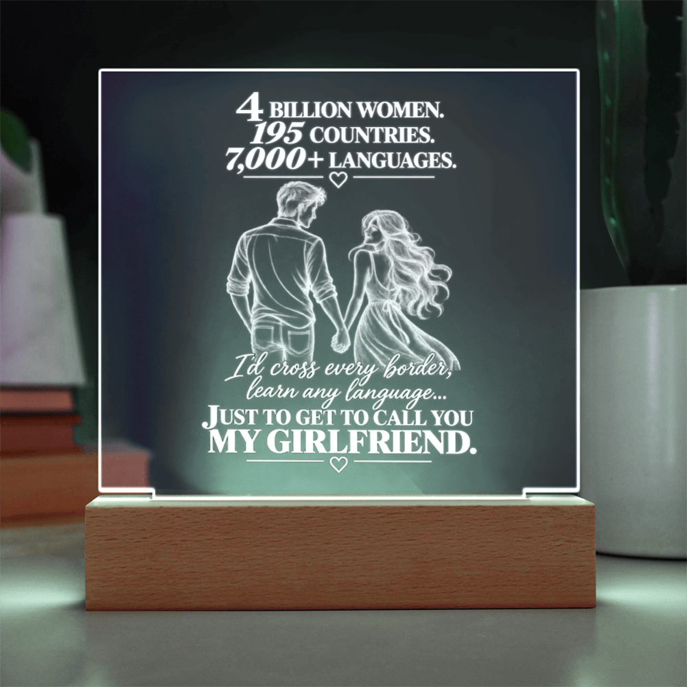 An acrylic LED light sign on a wooden base, featuring a romantic quote about a girlfriend and an illustration of a couple holding hands, displayed in a home setting.
