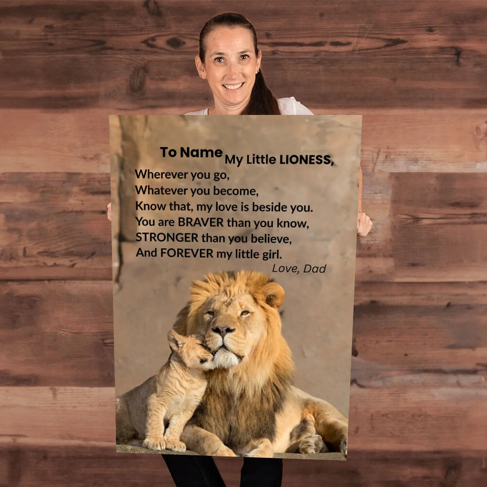 Person holding a personalized card with lions and a message on a wooden background