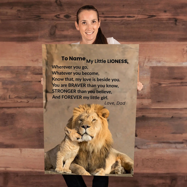 Person holding a personalized card with lions and a message on a wooden background