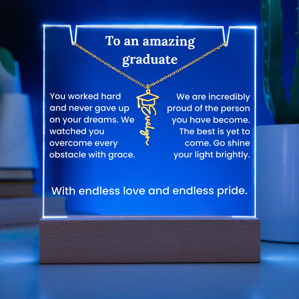 Neon sign with graduation-themed message and necklace graphic on a blue background