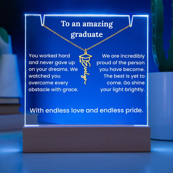 Neon sign with graduation-themed message and necklace graphic on a blue background