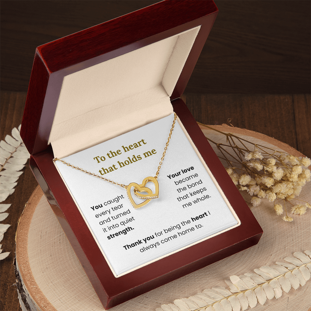 Close up of interlocking hearts pendant with cubic zirconia crystals – rose gold necklace for mom