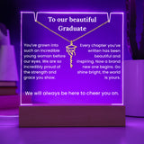 Decorative plaque with engraved message and graduation cap symbol on a purple background