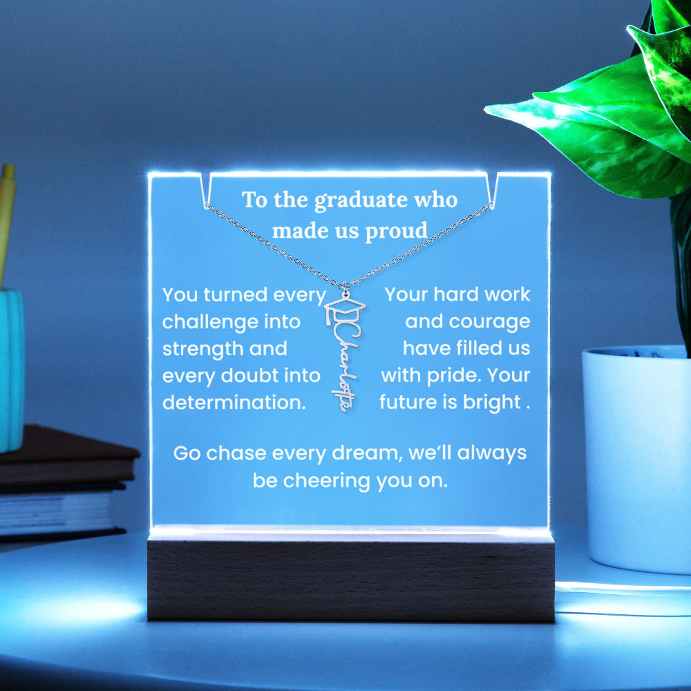 LED sign with a necklace and graduation message on a blue background