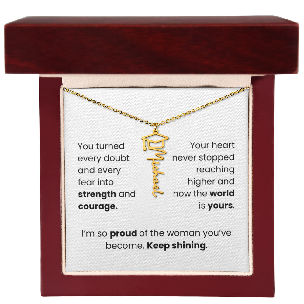 Gold necklace in a jewelry box with a sentimental message card.