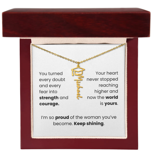 Gold necklace in a jewelry box with a sentimental message card.