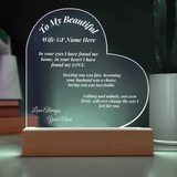 Heart-shaped LED sign with personalized message on a stand