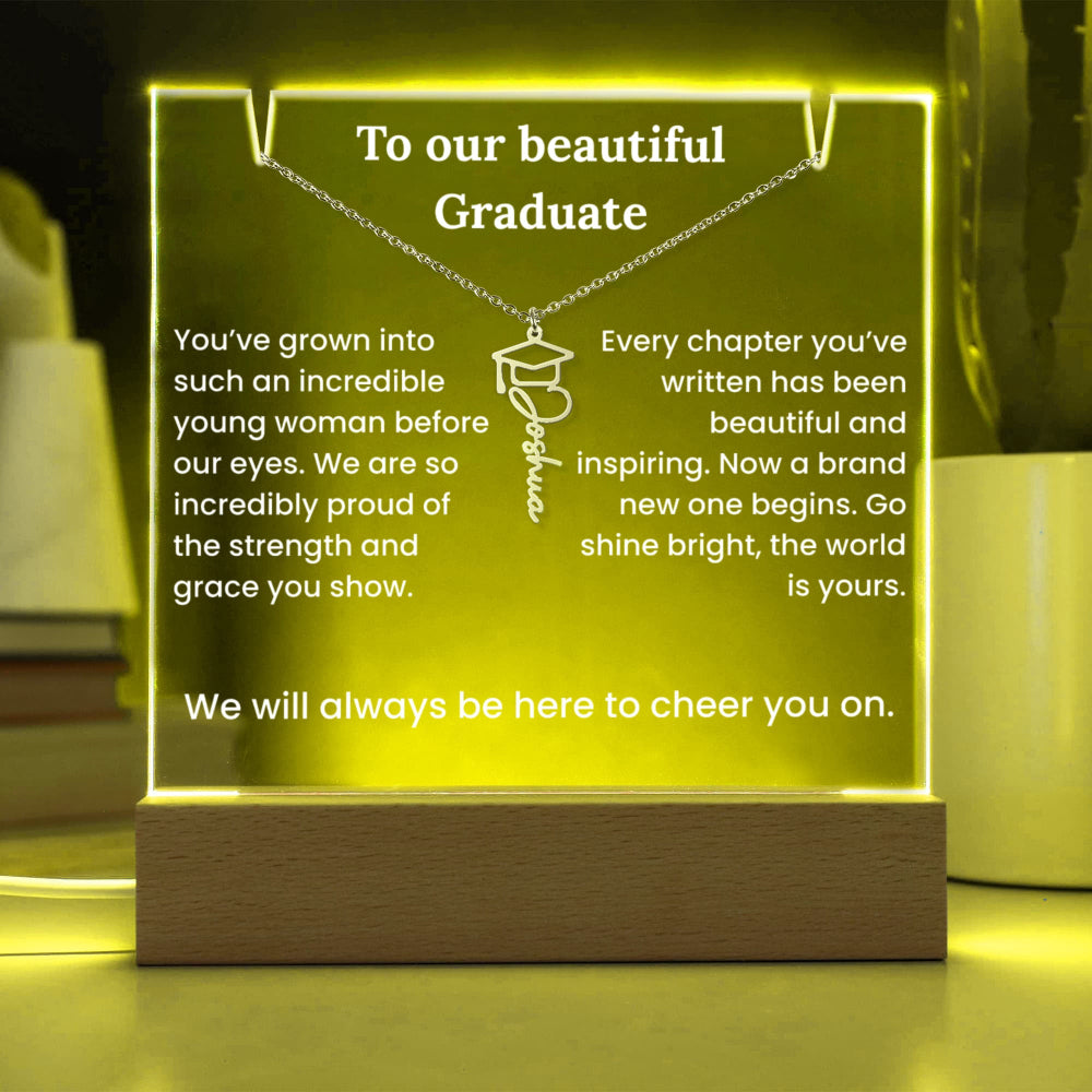 Graduation-themed illuminated sign with text and a necklace pendant design.