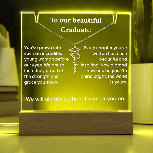 Graduation-themed illuminated sign with text and a necklace pendant design.