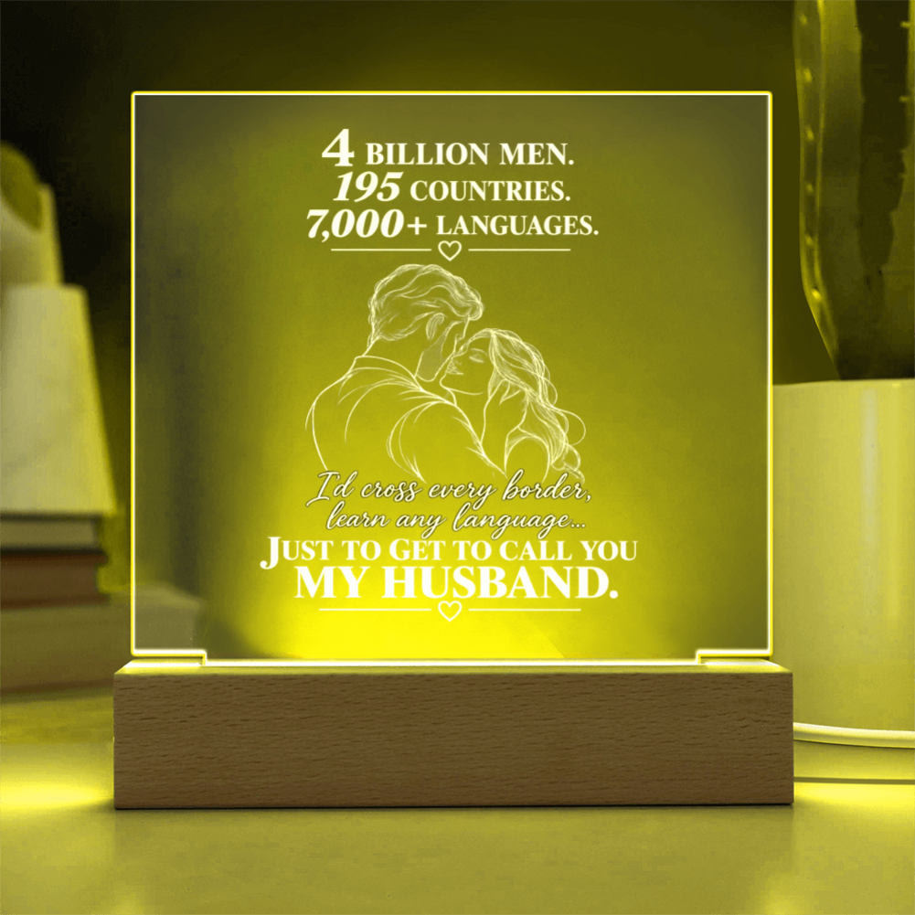 A rectangular acrylic LED night light with a wooden base, glowing with a warm yellow light. The front features a white laser-engraved illustration of a couple from behind, surrounded by small hearts, with romantic text that reads, 'I CHOSE YOU without knowing where life would take us.
