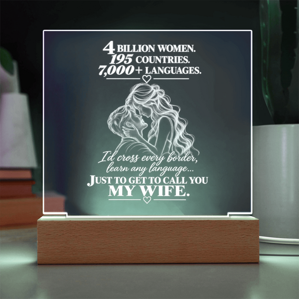 A rectangular acrylic LED night light on a wooden base, featuring a romantic quote and an illustration of a couple from behind, displayed on a tabletop.