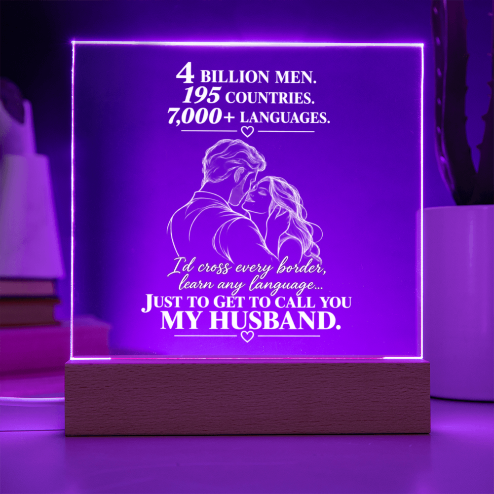 A rectangular acrylic LED lamp glowing with purple light on a wooden base, featuring white engraved text and an illustration of a couple with hearts. The message reads, 'I CHOSE YOU without knowing where life would take us.