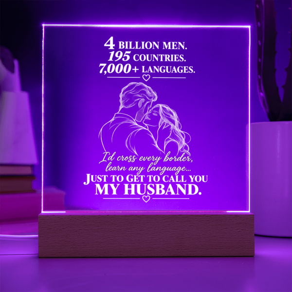 A rectangular acrylic LED lamp glowing with purple light on a wooden base, featuring white engraved text and an illustration of a couple with hearts. The message reads, 'I CHOSE YOU without knowing where life would take us.