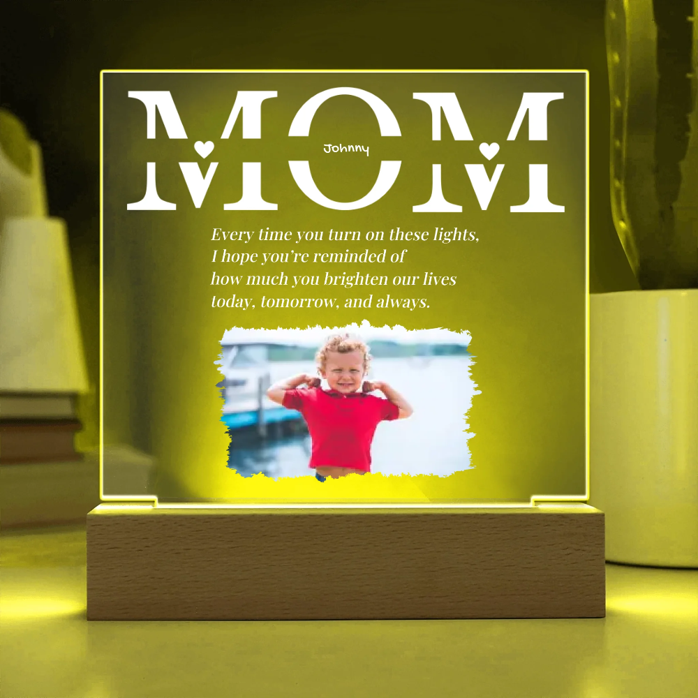 Decorative light with 'Mom' text and a photo of a child on a wooden base.