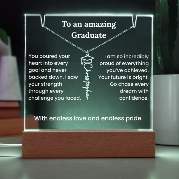 Decorative plaque with engraved message and necklace on a wooden base
