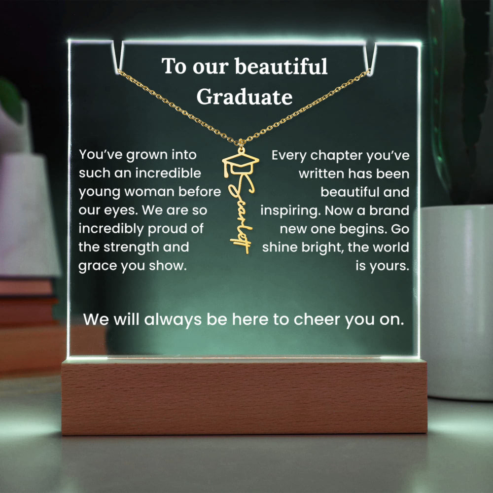 Decorative plaque with a necklace design and graduation message on a stand.