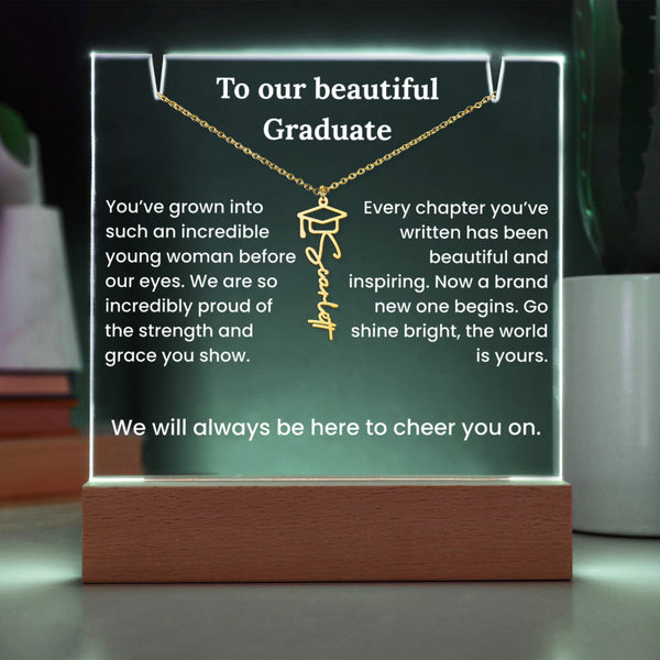 Decorative plaque with a necklace design and graduation message on a stand.